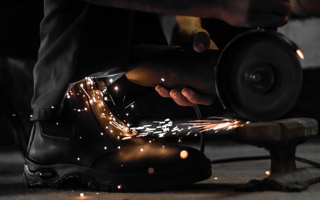 Technician performing maintenance on robot